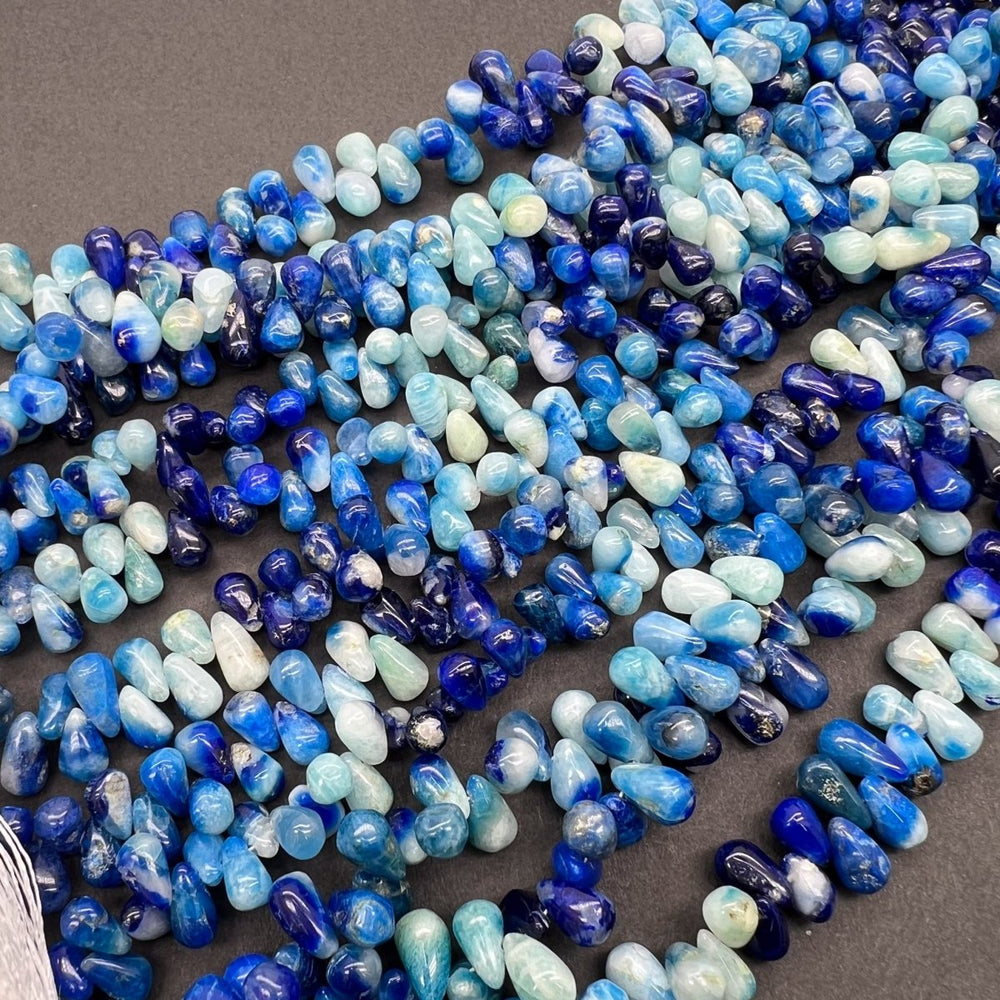 1/6連*UVで光るレア石*アフガナイト*スムースドロップ*約7.5×4ｍｍ前後 - aoneko_gems
